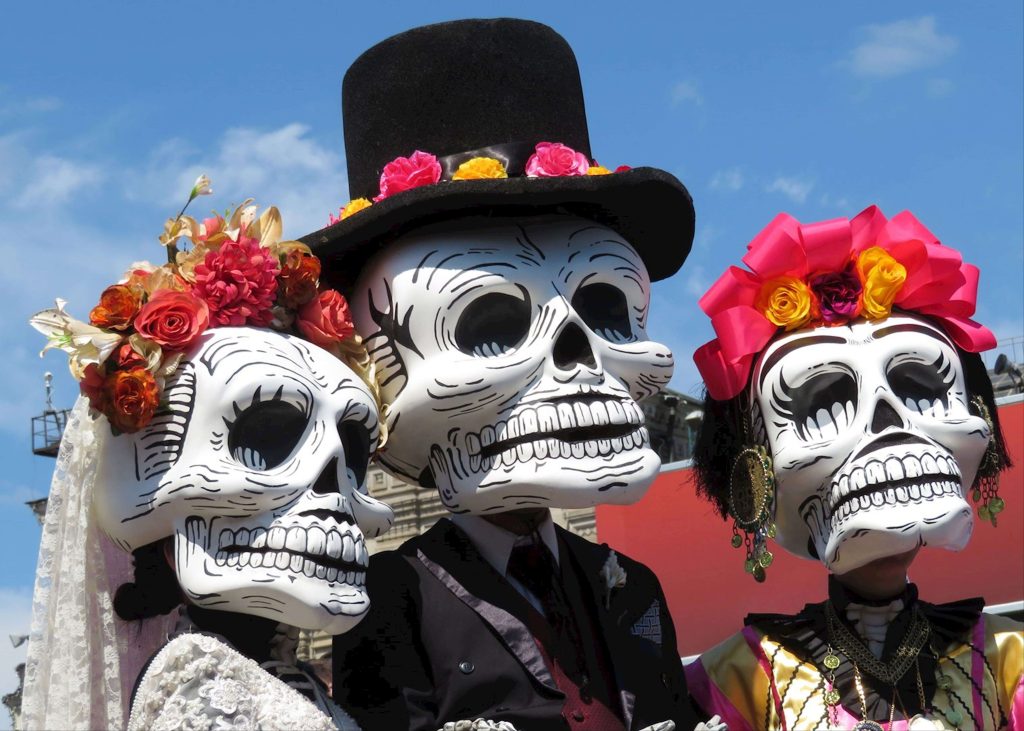 People in traditional skeleton costumes