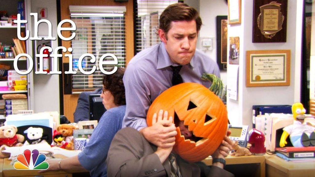 Man wearing pumpkin head in The Office